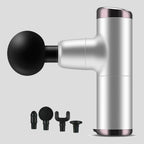 No More Sore mini massage gun in silver gray with its four interchangeable massage heads