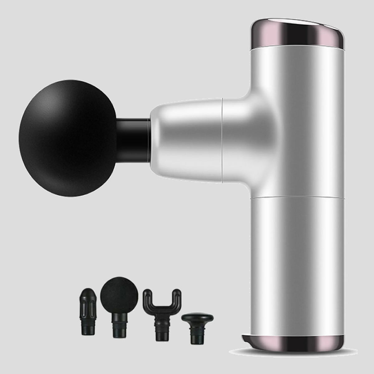 No More Sore mini massage gun in silver gray with its four interchangeable massage heads