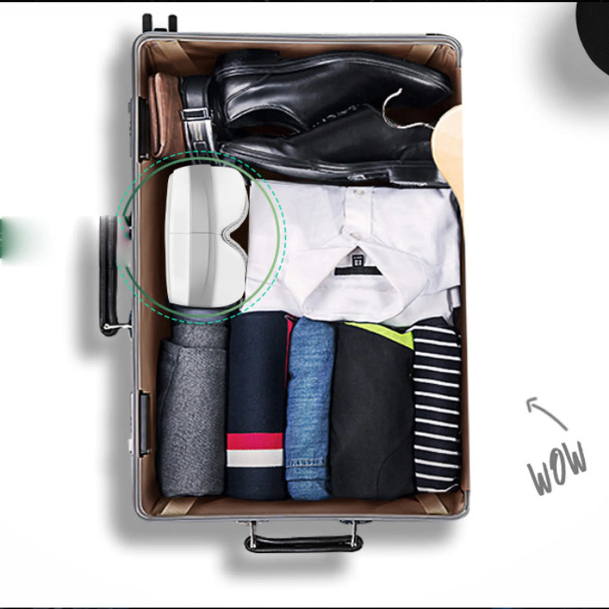Eye Lux eye massager folded in half and packed in a suitcase with clothes and shoes