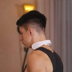 Man wearing the white K3 neck massager around the back of his neck