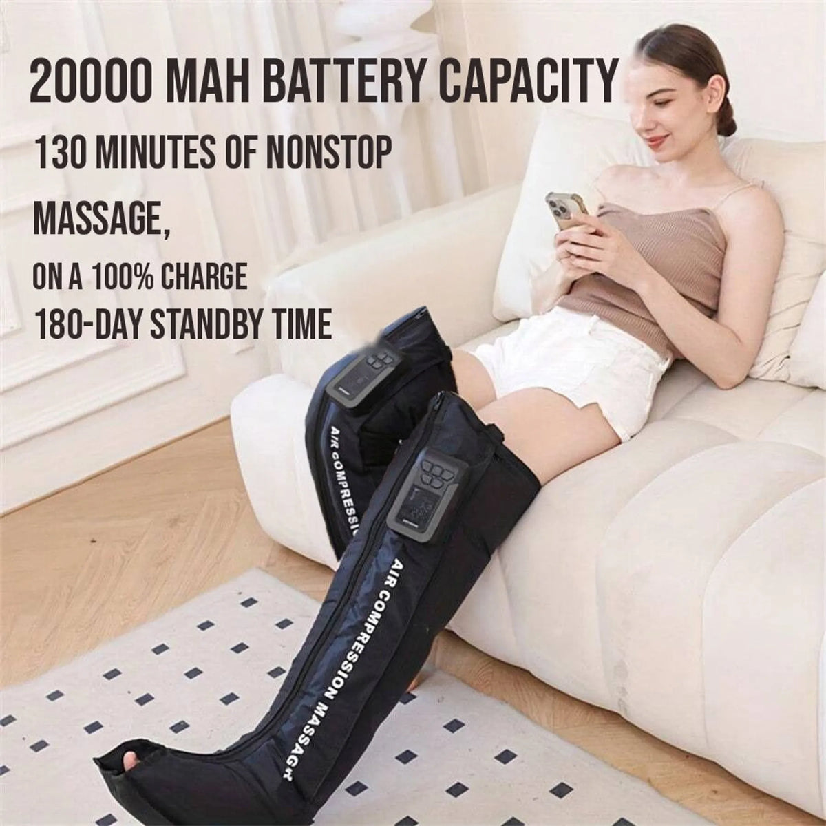 Woman using her phone on a sofa while wearing the leg wraps, with text about a 20000 mAh battery, 130 minutes of use per charge and 180 day standby
