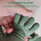 Close-up of a hand pressing the soft green silicone fingers of the neck massager to show how flexible they are