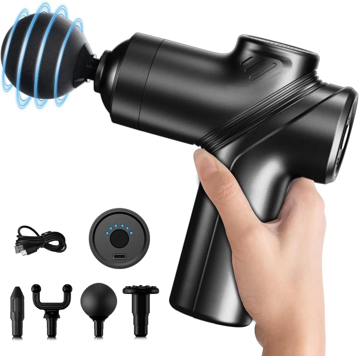 Hand holding the black mini massage gun, shown with its charging cable, case and four massage heads