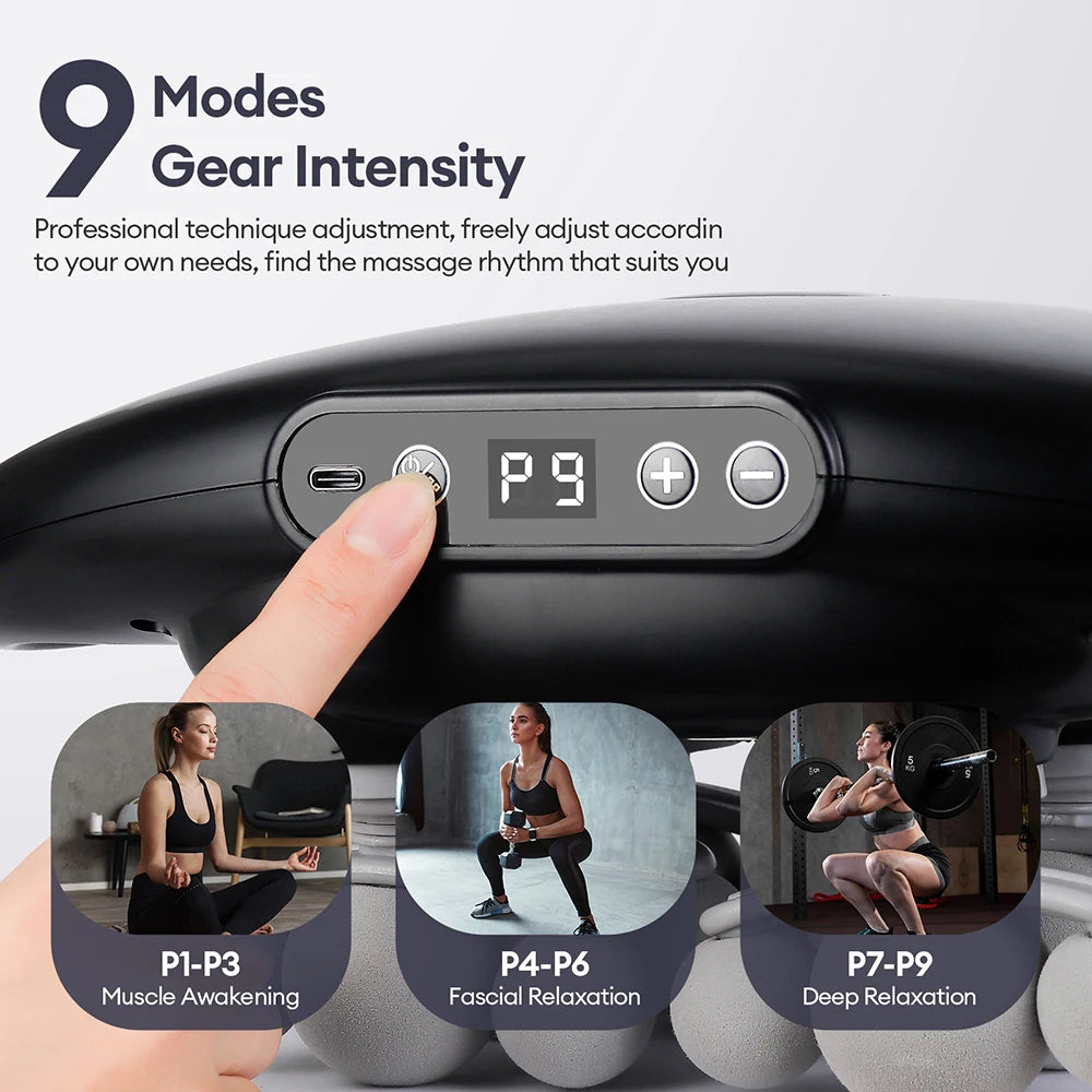 Finger pressing the digital display on the fascia gun, showing 9 modes grouped for muscle warm-up, fascia relaxation and deep relaxation