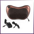 Brown shiatsu neck and back massage pillow with its home adapter and car adapter