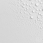 Fine water droplets on a white surface, showing the light mist of the Innatus pillow spray