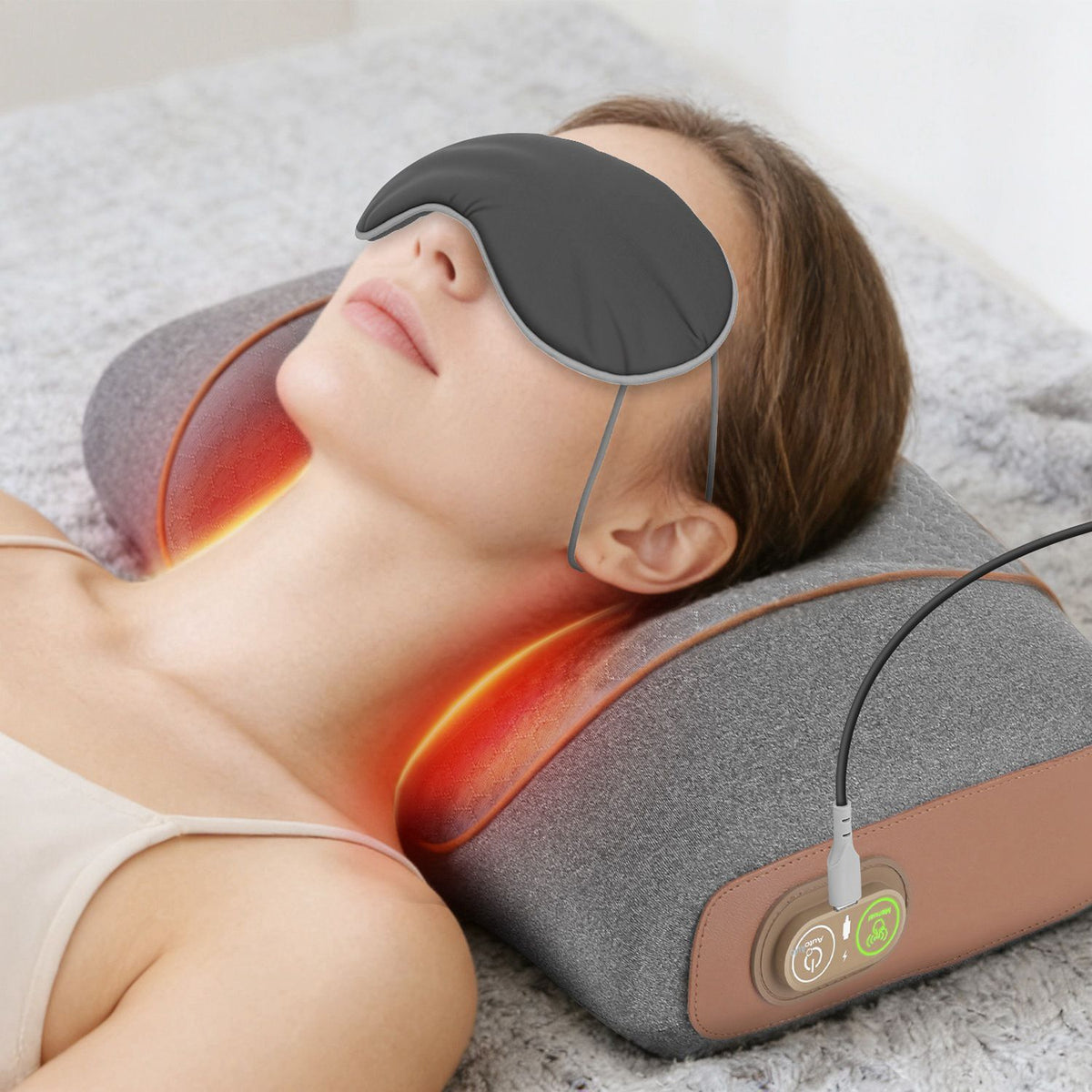Woman wearing the eye mask while resting on the glowing neck pillow