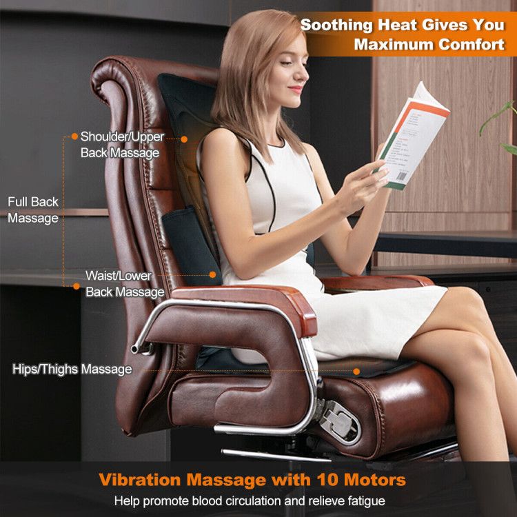 Woman reading in a leather office chair with the black massage cushion, labeled with shoulder, back, lumbar and thigh massage areas