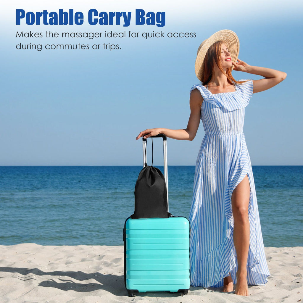 Woman on a beach with a suitcase and the pillow's carry bag