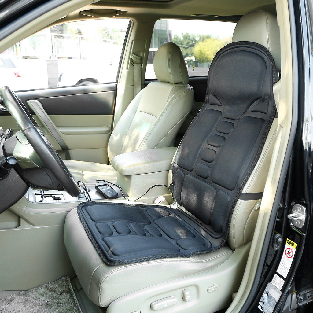 Massage seat cushion strapped to the front seat of a car