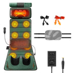 Green massage mat laid flat with glowing vibration spots, neck heat and foot massager, shown with the lumbar pillow, earplugs, controller and power adapter